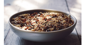 Brown rice in a bowl by Suzy Hazelwood