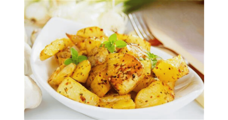 Roast potatoes on a plate with fork