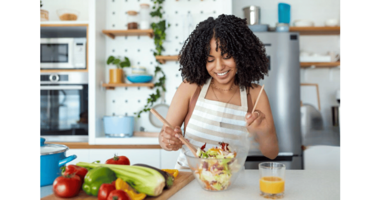 young lady with a salad bowl in a kitchen