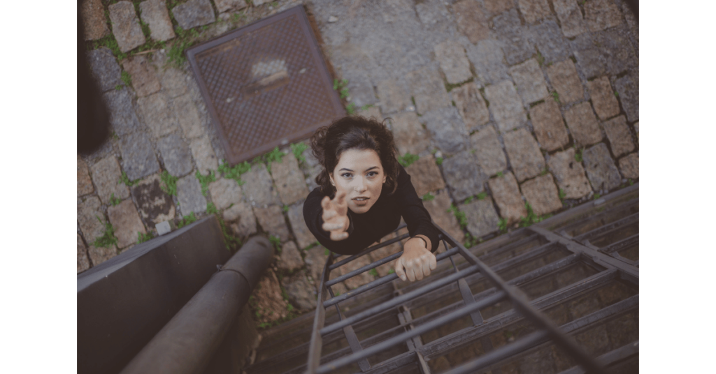 Photo of a woman climbing on a ladder