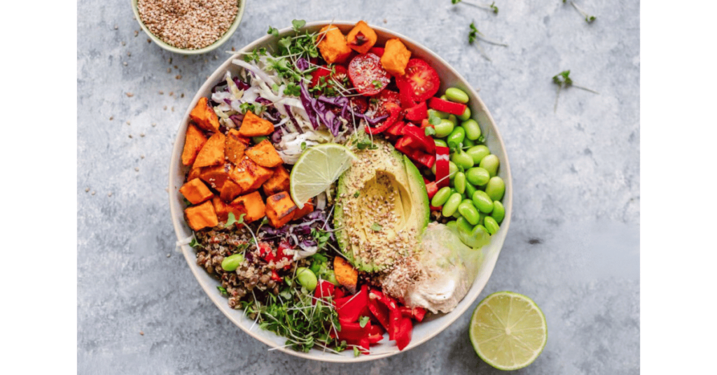 Variety of whole foods plant-based in a white bowl