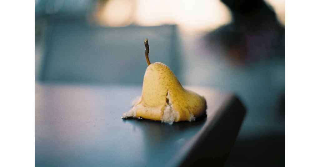 Splashed Pear on a Table by Markus Spiske
