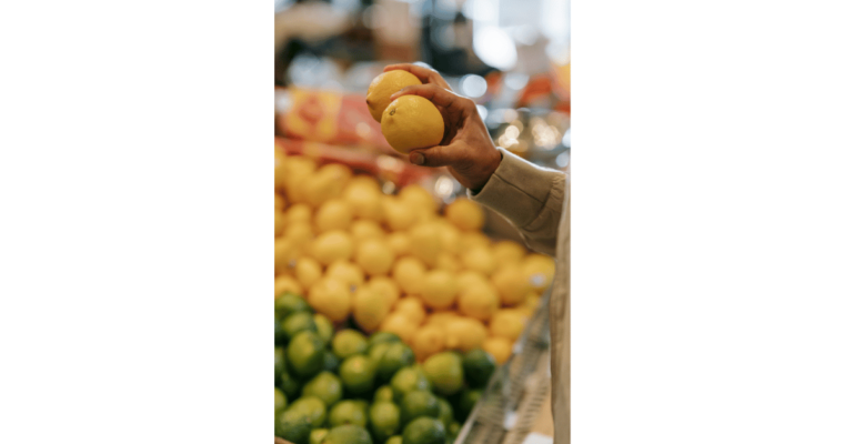 Pexels|Michael Burrows photo of faceless man choosing citrus fruit in supermarket