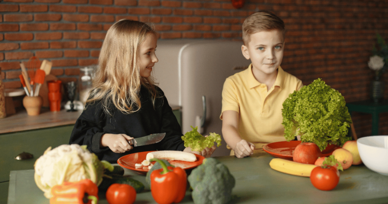 Children with fresh vegetables and fruits cooking from Gustavo Fring