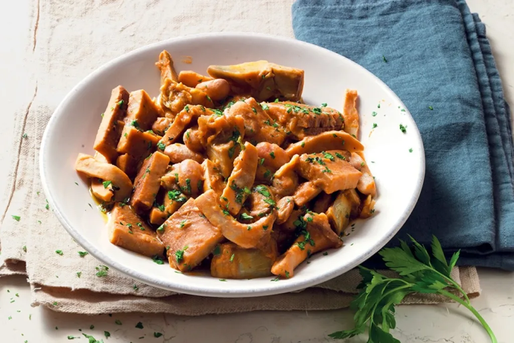 Seitan with mushroom bilton on a bowl upon a cloth for plant-based protein.