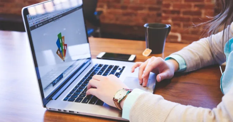 Student typing on keyboard on the table for meal planning.