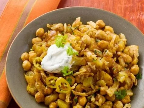 Curried chickpea & potato potjie on a bowl a recipe for quick & easy plant-based weeknight dinners in south africa.