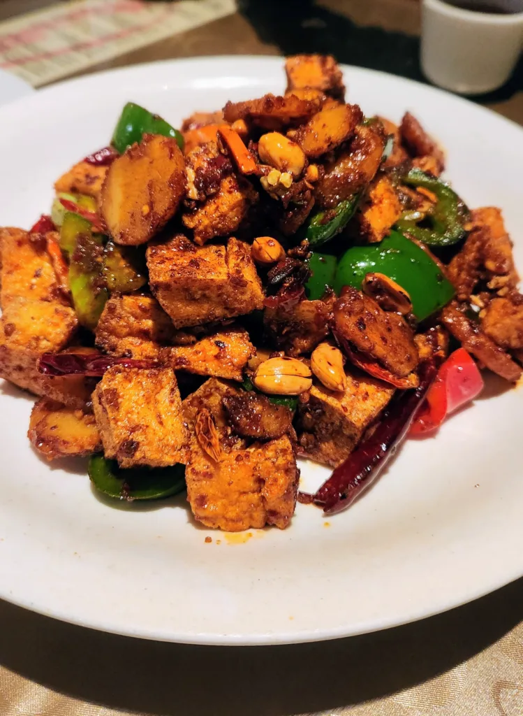 Tofu and peppers on a white plate your plant-based protein source