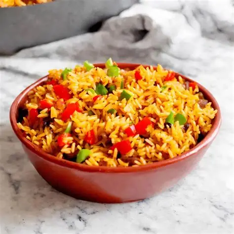 Nando's spicy rice on a brown bowl.